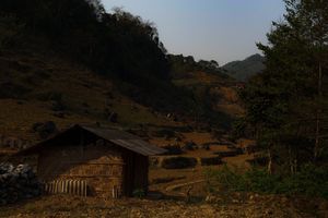 Small wooden huts on the side of a mountain