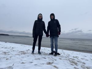 Us wearing winter clothes in the snow of Estonia