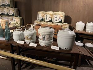 Old sake barrels in a museum exhibit